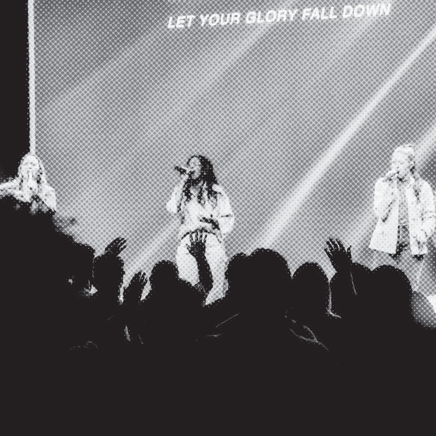 The worship team leading, hands raised in the congregation